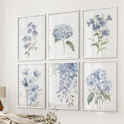 Gallery wall of soft blue botanical prints. Garden flowers summer wall decor. White frames for bedroom.