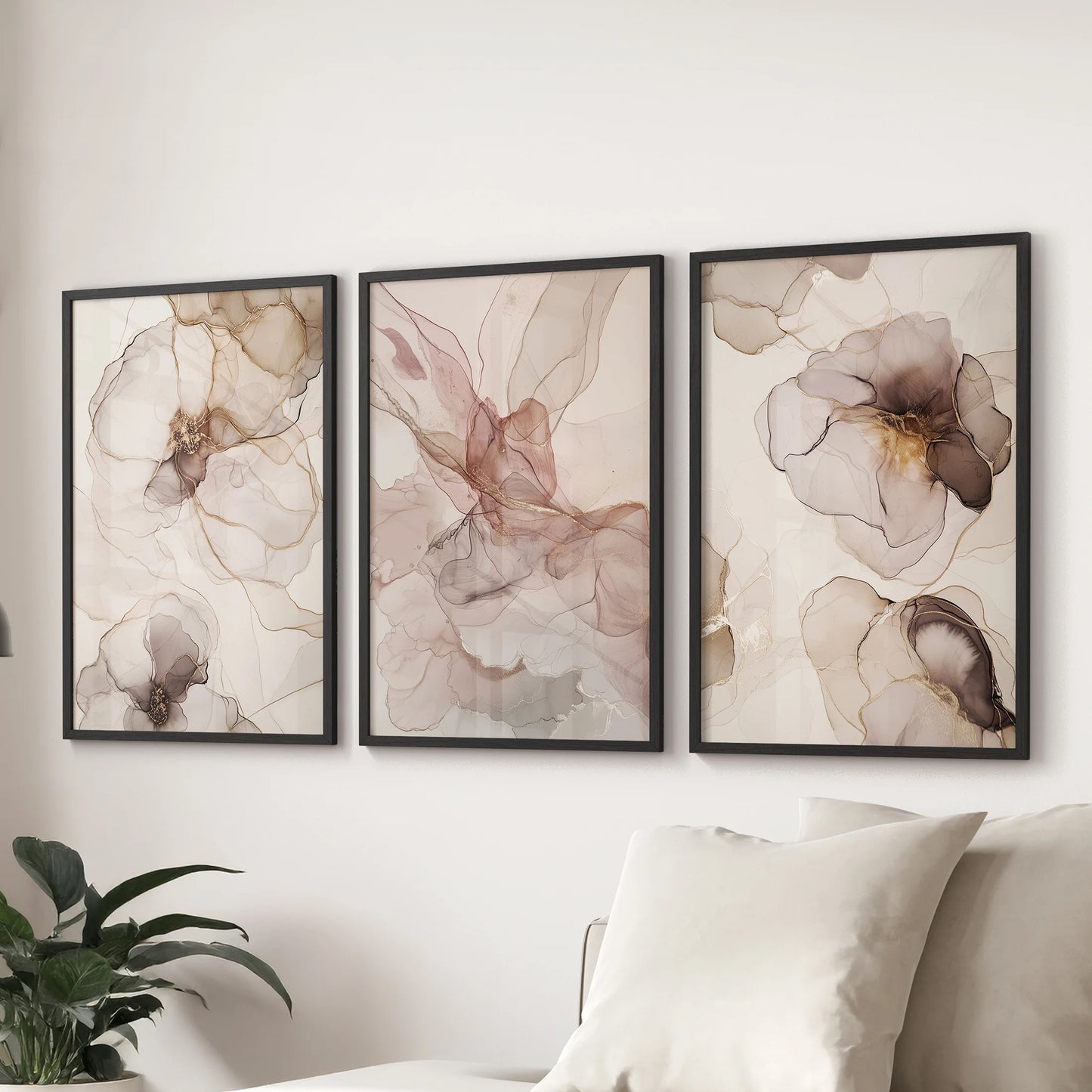A wall art 3 set of neutral blush and beige tones in sleek black frames brings calm balance to the sitting room over the sofa.
