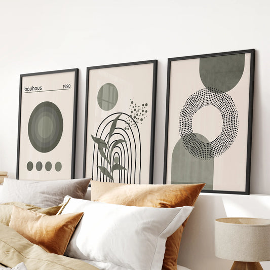 Sage green geometric wall art, set of three, framed in black and styled for the bedroom, hangs over the bed with clean mid-century lines.
