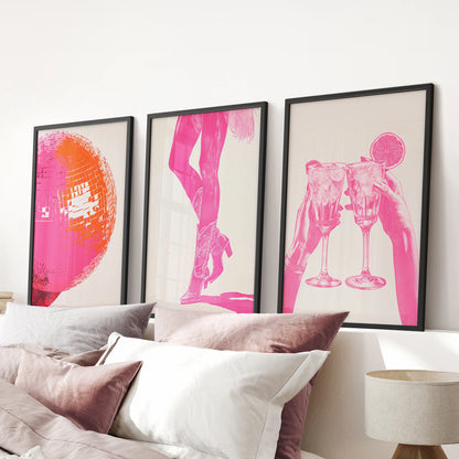 Hot pink abstract art prints, set of 3 pictures, are black framed and placed above the bed headboard, saturating a pink bedroom with bold color.
