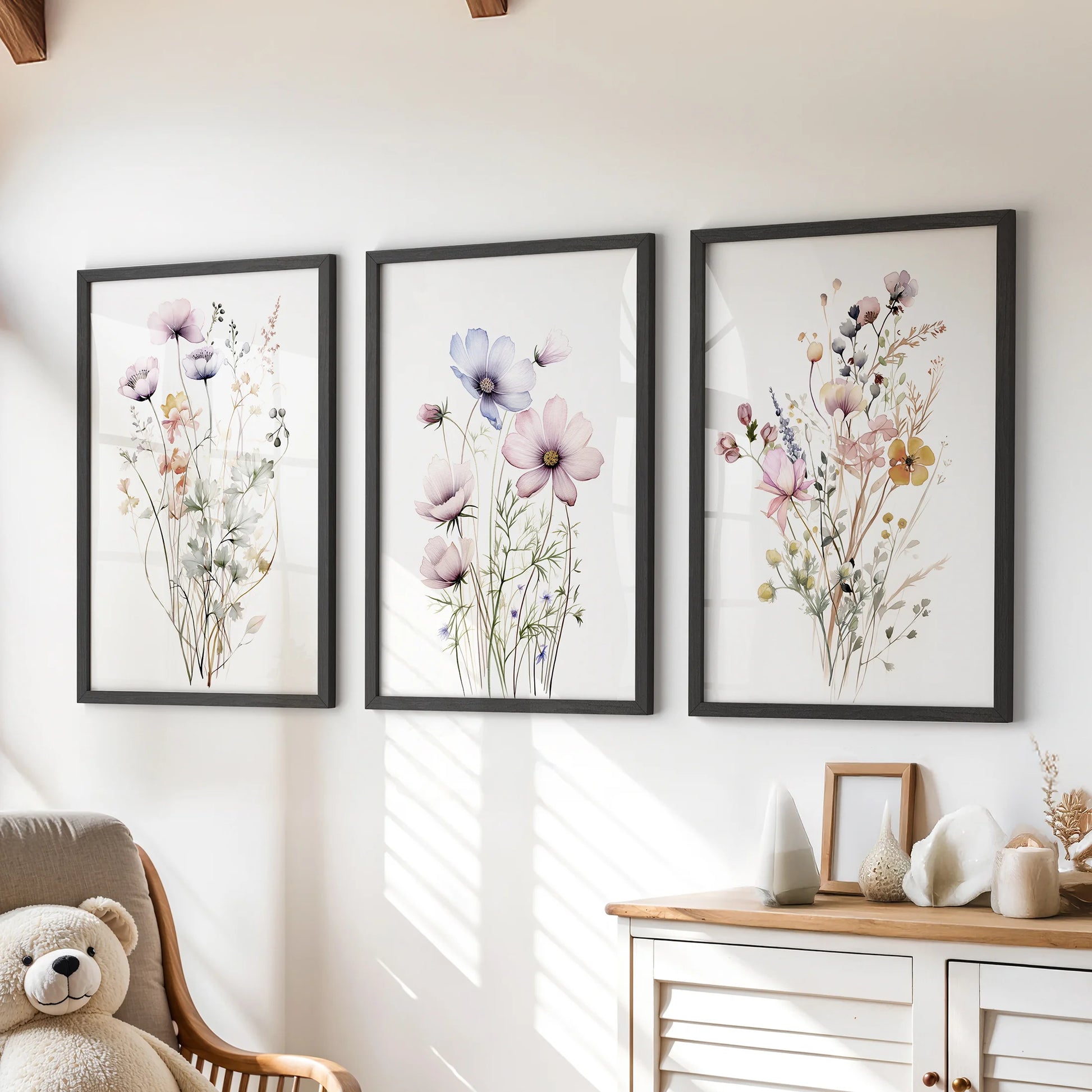 A 3-piece wildflower wall art set in black frames hangs above the chest of drawers, bringing meadow color and cheer to a kids playroom.