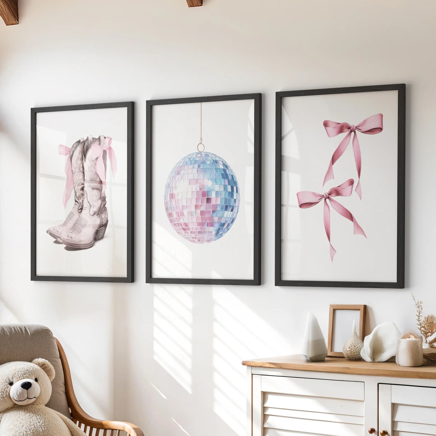 This three-piece bow-themed wall art set, framed in black, perches above the kids’ dresser adding a playful coquette touch in pink and blue.