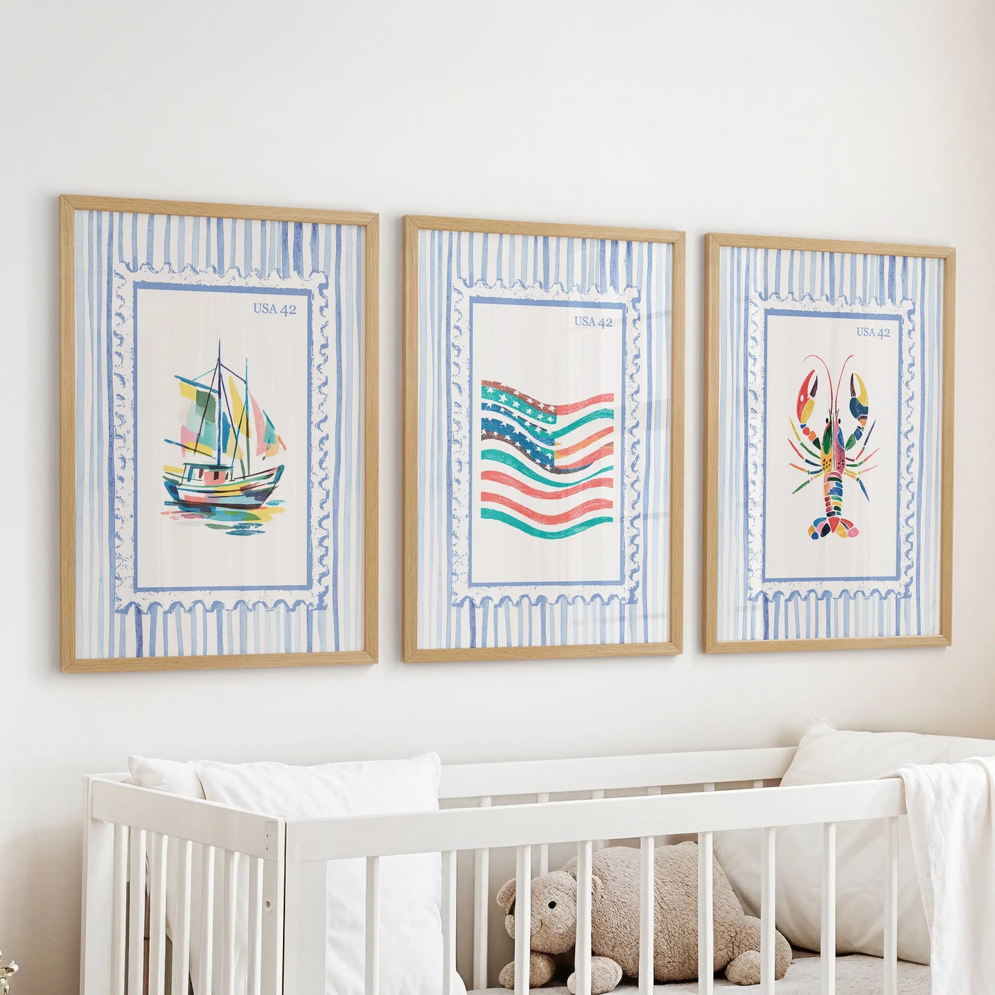 This wall-hanging trio of bright coastal prints, framed in warm oak, rests above the crib to soften the baby’s room with coastal color.