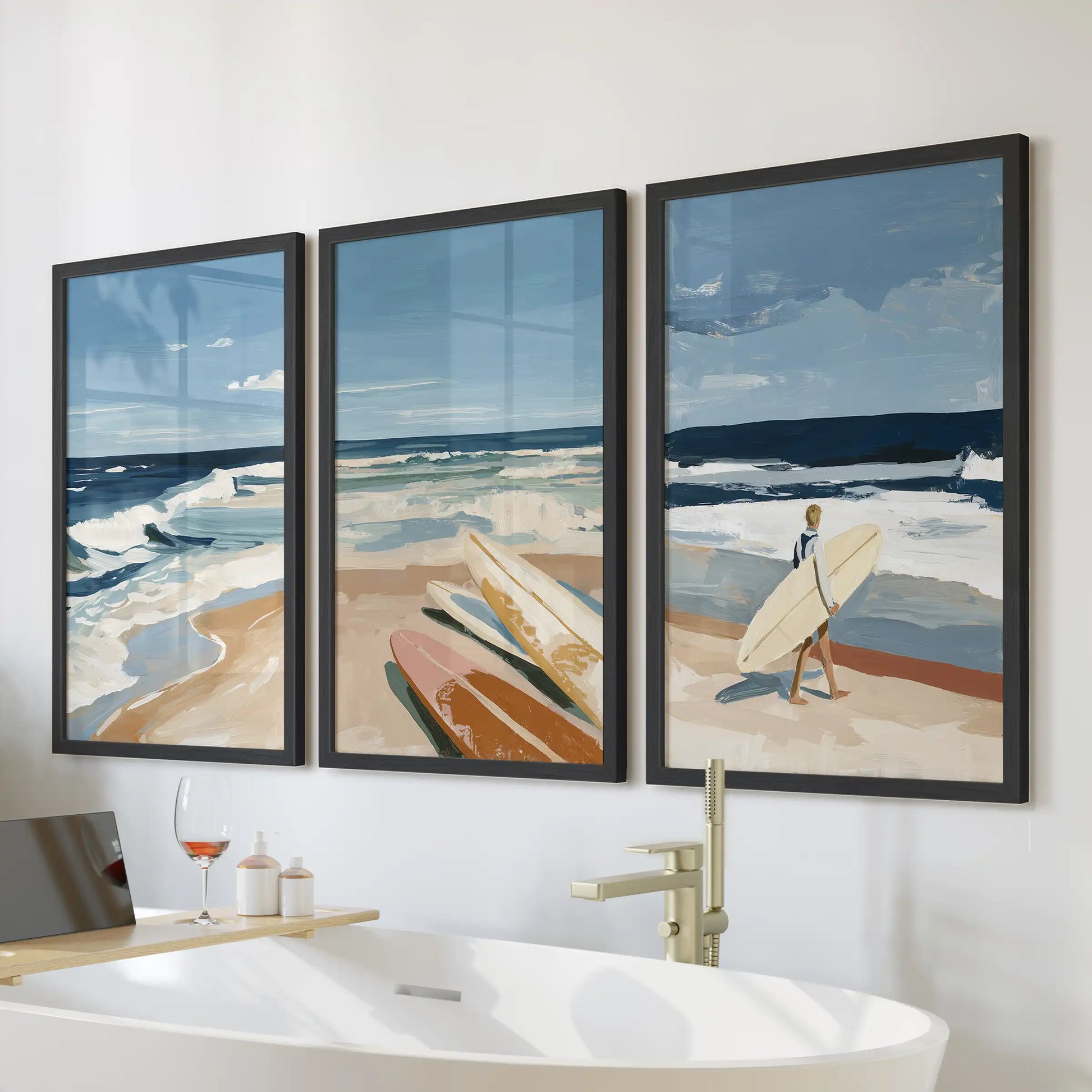 California beach culture wall art set of three brings airy coastal vibes, with black-framed prints styled in a bathroom over the bathtub.