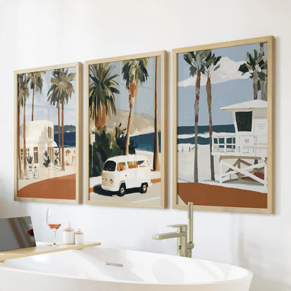 California coast cliffs wall art, three natural-wood framed prints, brings warm texture to a bathroom wall hung above the bath.