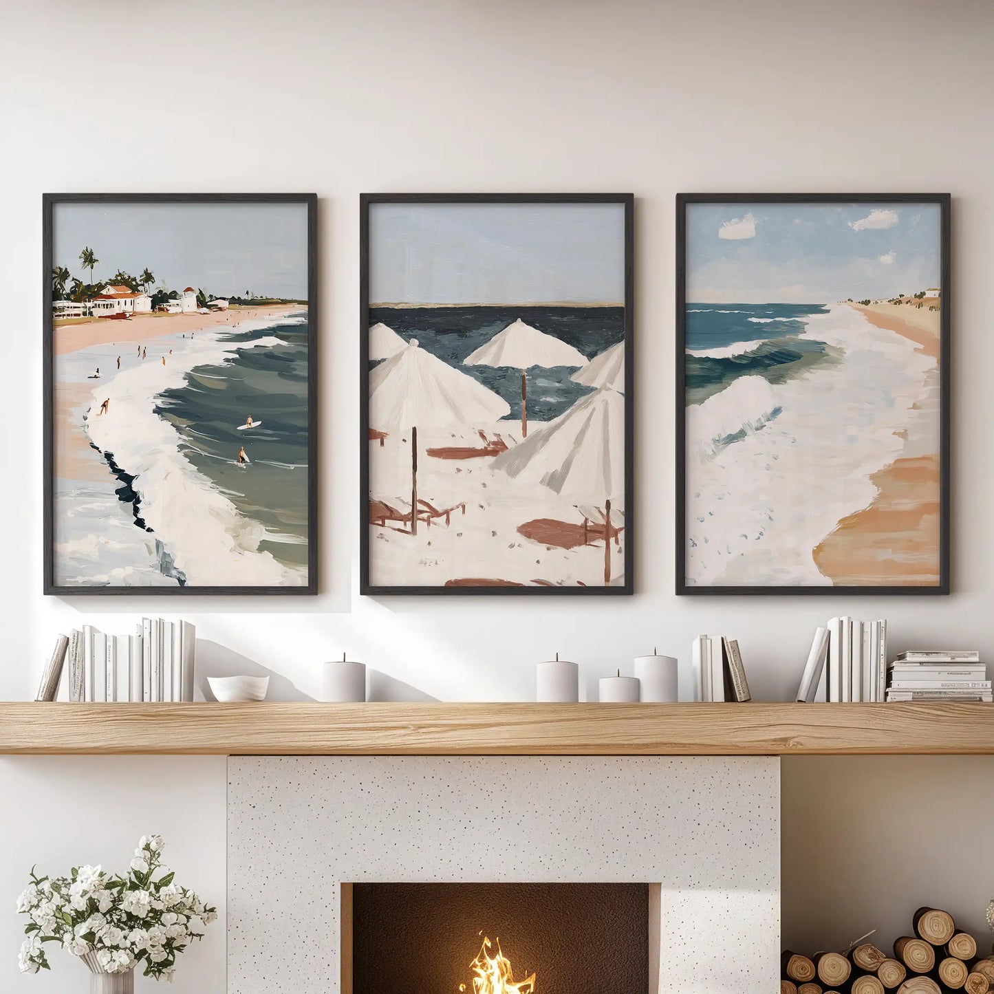Three black-framed seascape horizon prints span the sitting room mantel, creating refined coastal wall art with balanced lines.