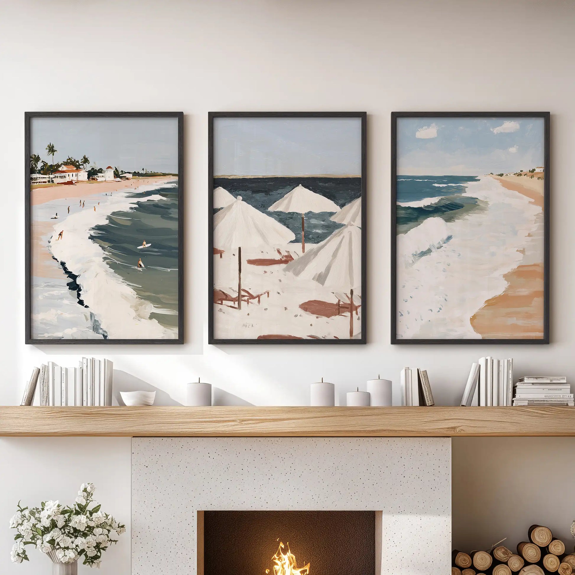 Three black-framed seascape horizon prints span the sitting room mantel, creating refined coastal wall art with balanced lines.