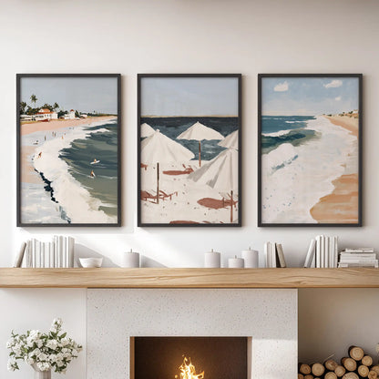 Three black-framed seascape horizon prints span the sitting room mantel, creating refined coastal wall art with balanced lines.