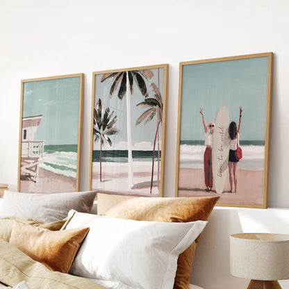 A solid-oak 3-piece picture set of California lifeguard towers hangs above the bed, giving the bedroom a bright, coastal focal point.