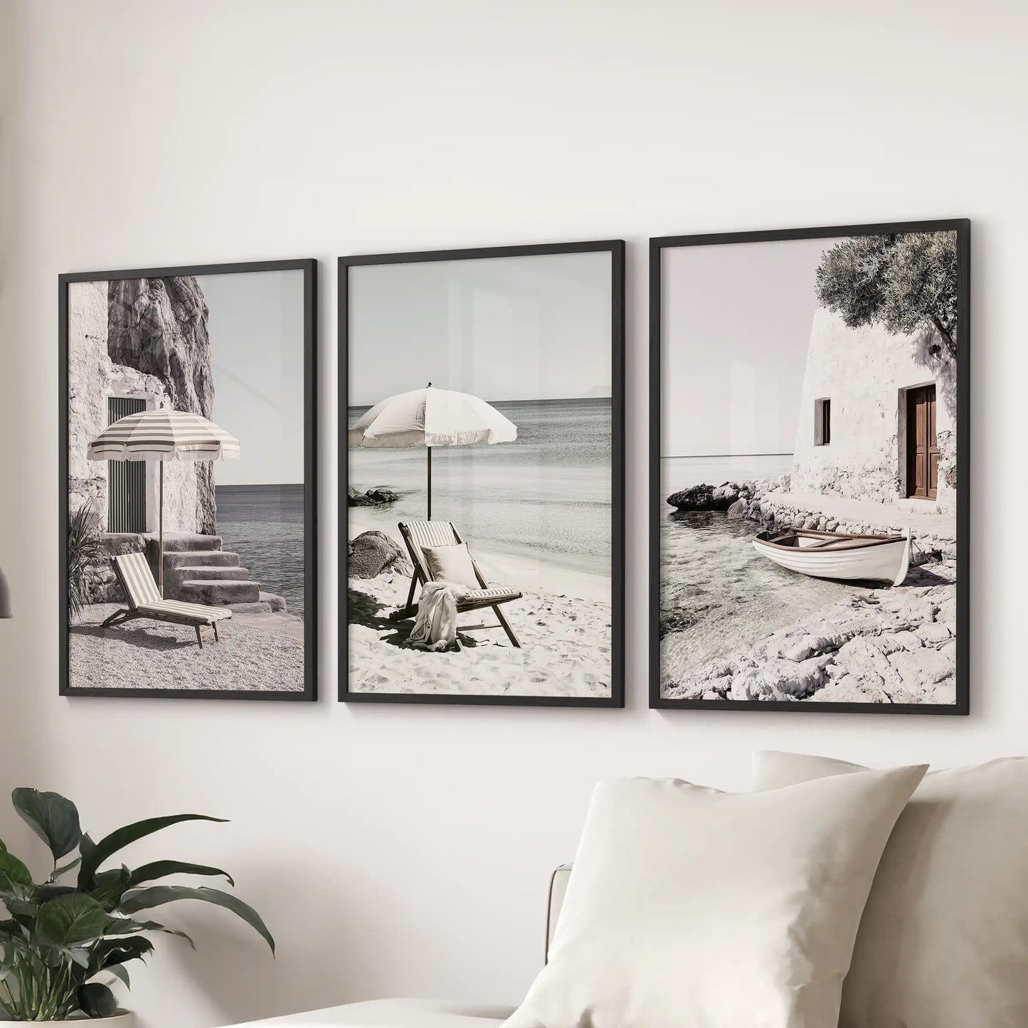 Art prints come as a set of three featuring Aegean seaside vistas in black frames. Positioned above the couch, they bring a sunlit coastal calm to the lounge.