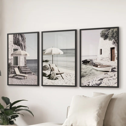 Art prints come as a set of three featuring Aegean seaside vistas in black frames. Positioned above the couch, they bring a sunlit coastal calm to the lounge.
