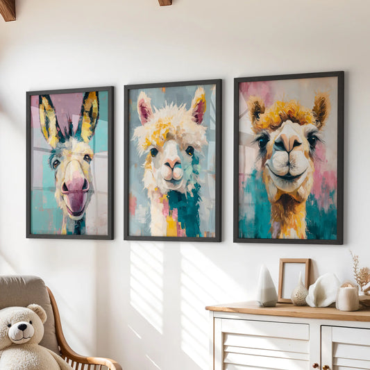 Vibrant llama portraits 3-piece poster set, black framed prints bringing cheerful color over the chest of drawers in a cozy children’s room.