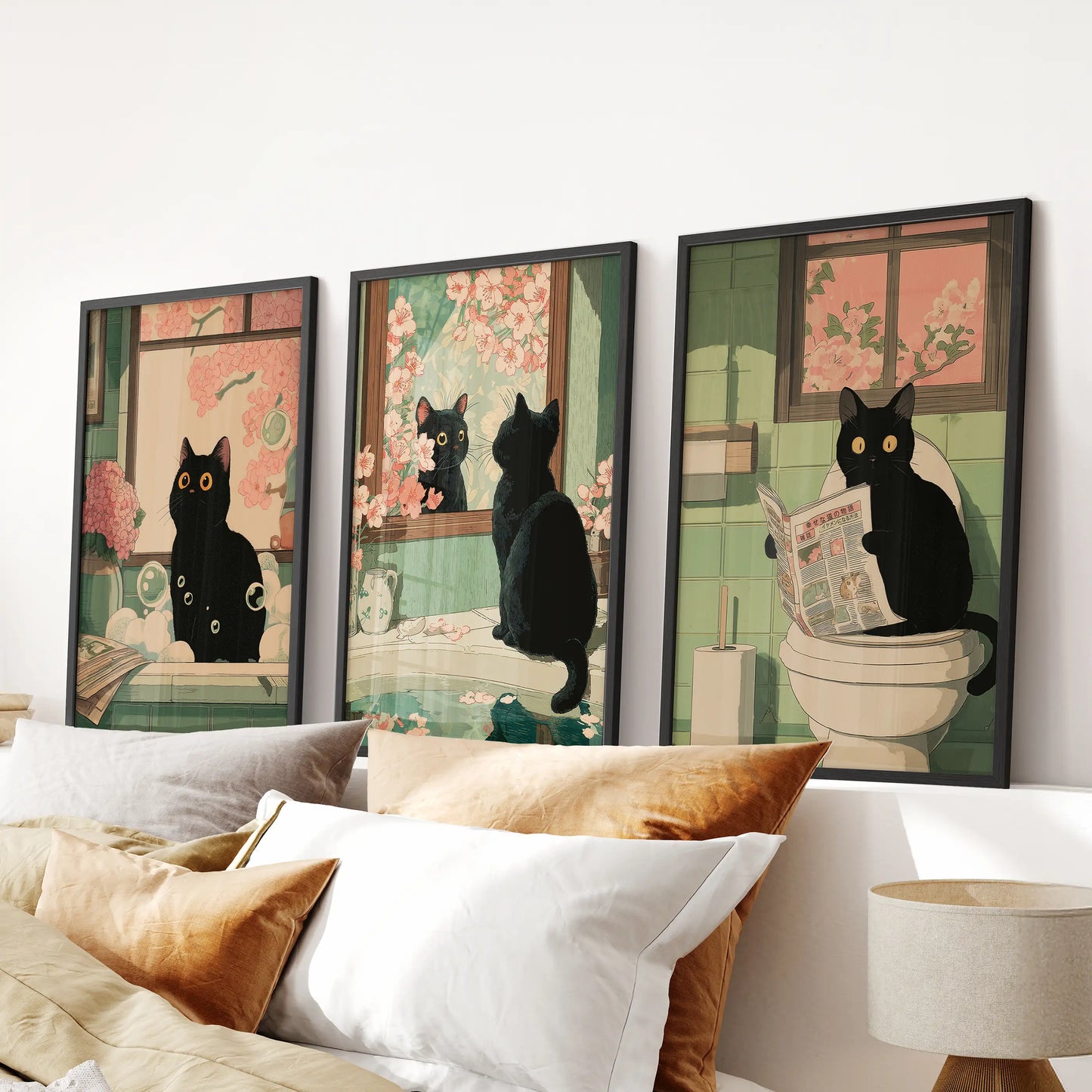 This 3-piece set of black-framed prints shows a Japanese-style cat on a toilet, adding playful wall art above the bedroom headboard.