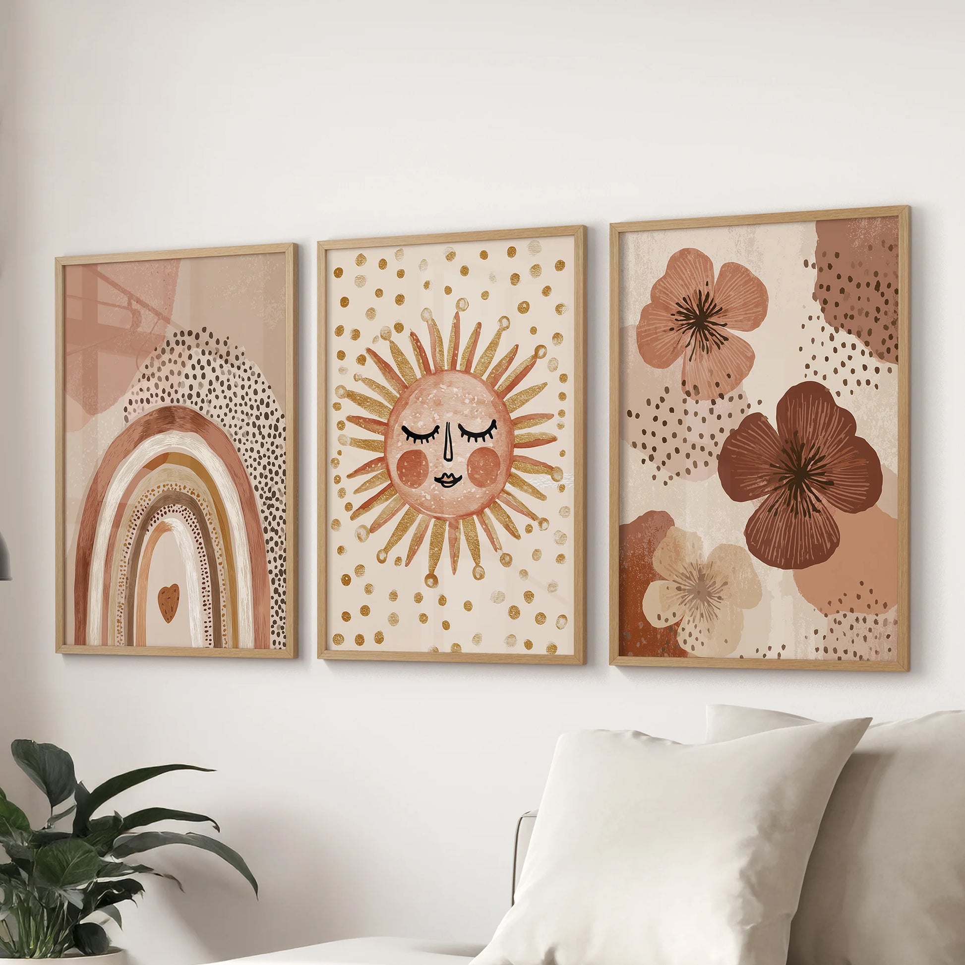 A pastel rainbow set of 3 prints in oak frames fills the lounge with soft color and balance, displayed neatly above the sofa.