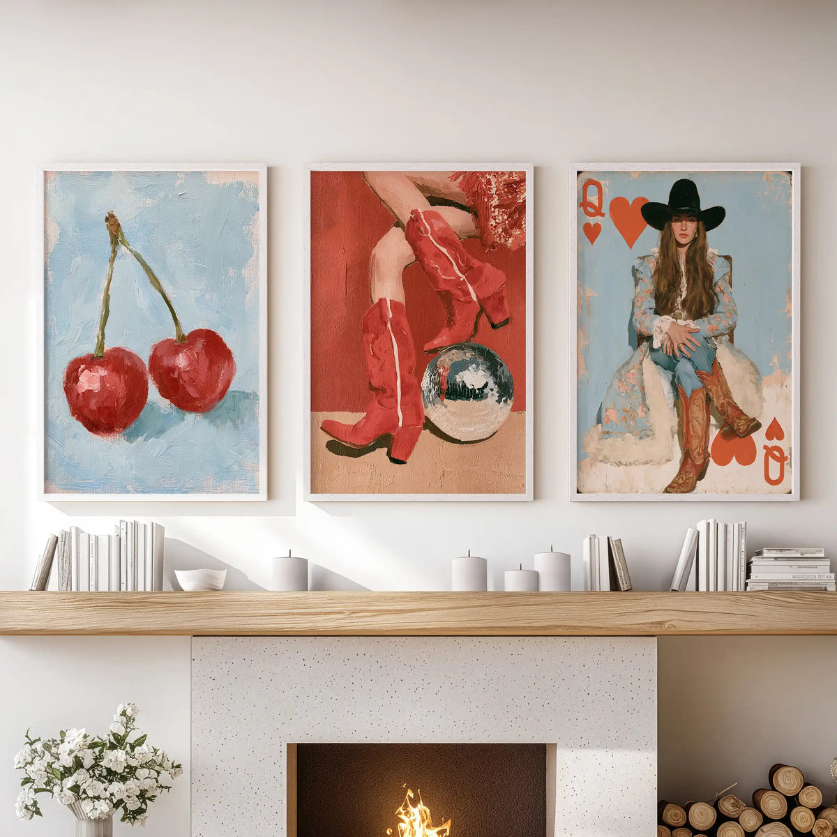 A three-poster cherries art bundle in white frames sits above the fireplace mantel, adding a sweet pop of color to the family room.