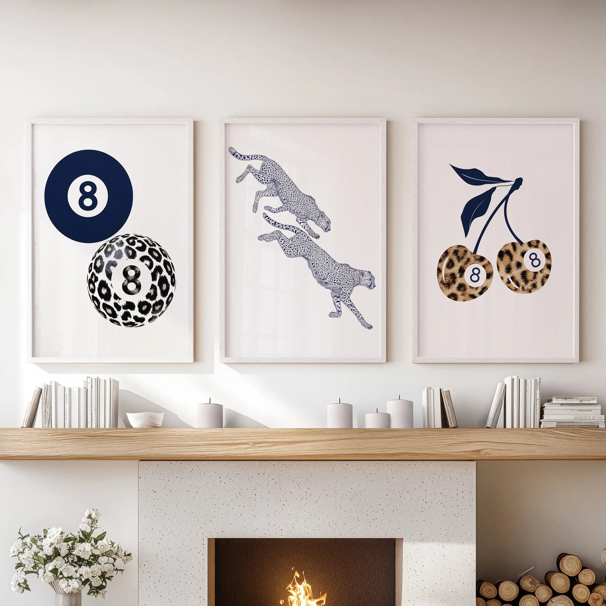 Three white-framed prints with retro pool-ball cherries add a playful pop as wall decor above the living room mantle.
