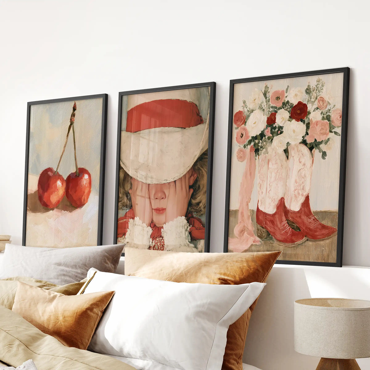 Vintage girl illustration wall hanging set of 3 in black frames crowns the bedroom, lined up just above the headboard.