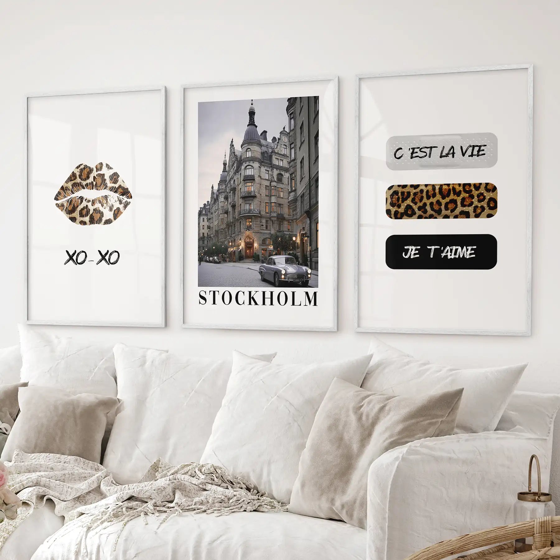 Stylish Stockholm city wall art with leopard print and quotes for gallery wall. College girl dorm lips poster. White frames above the sofa.