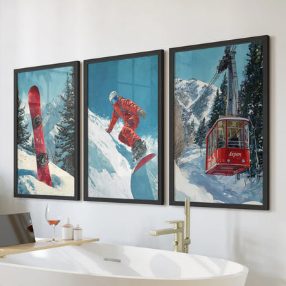 Vintage snowboarder wall art, a 3-piece poster set in black frames, adds a retro alpine vibe over the bathroom tub and ties winter sport style into the space.