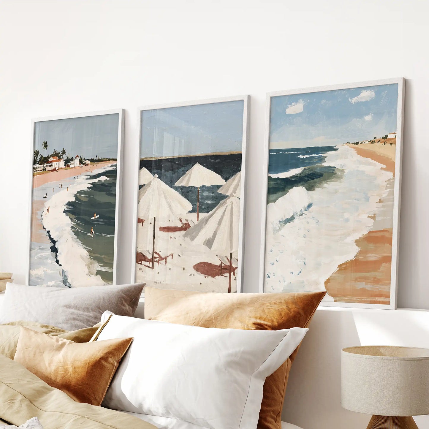 Ocean waves art trio, three-piece artwork in white frames, brings soft motion to a bedroom when installed as wall decor over the headboard.