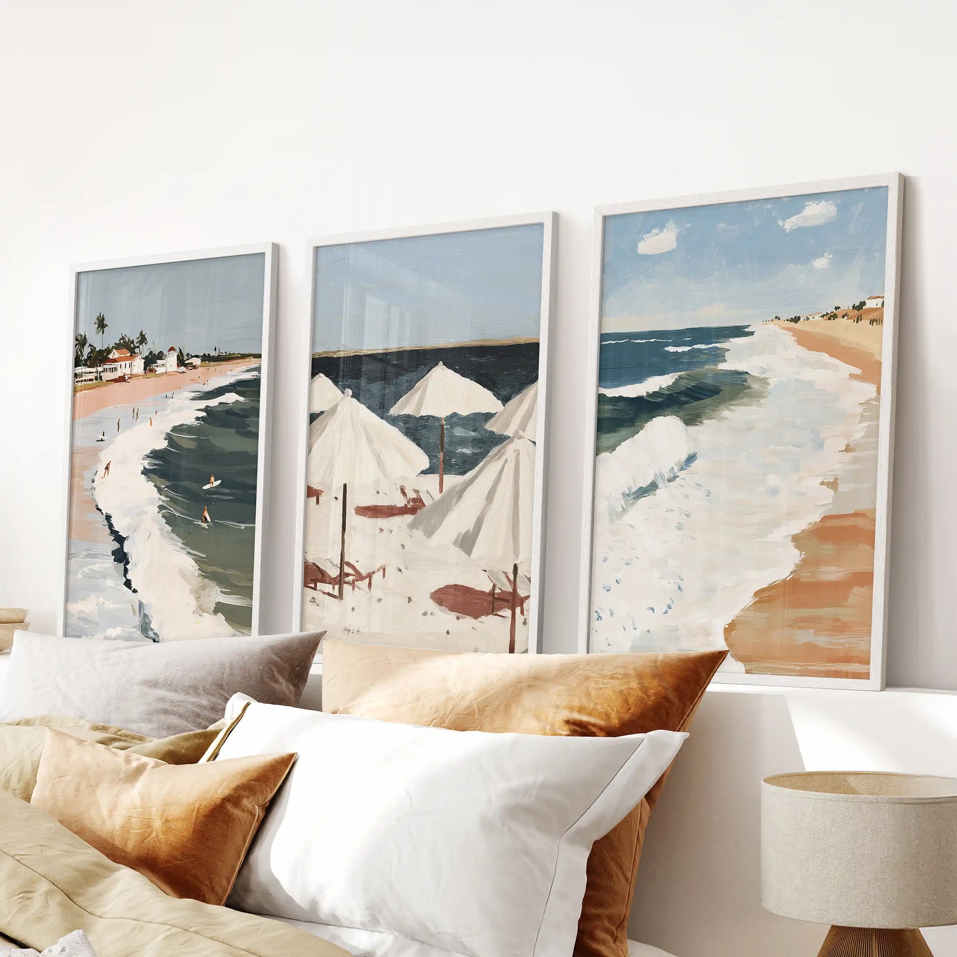 Ocean waves art trio, three-piece artwork in white frames, brings soft motion to a bedroom when installed as wall decor over the headboard.