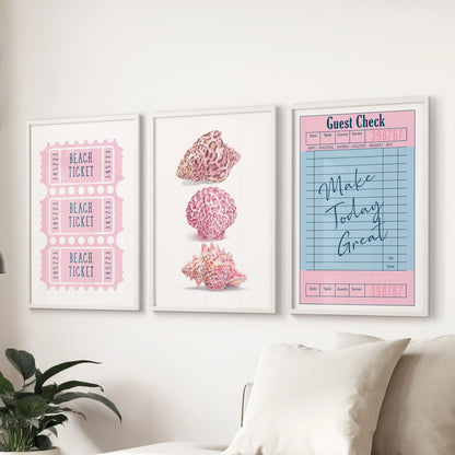 Preppy pink beach icons in a set of 3 wall prints with white frames, brightening the sitting room above the sectional with soft coastal color.