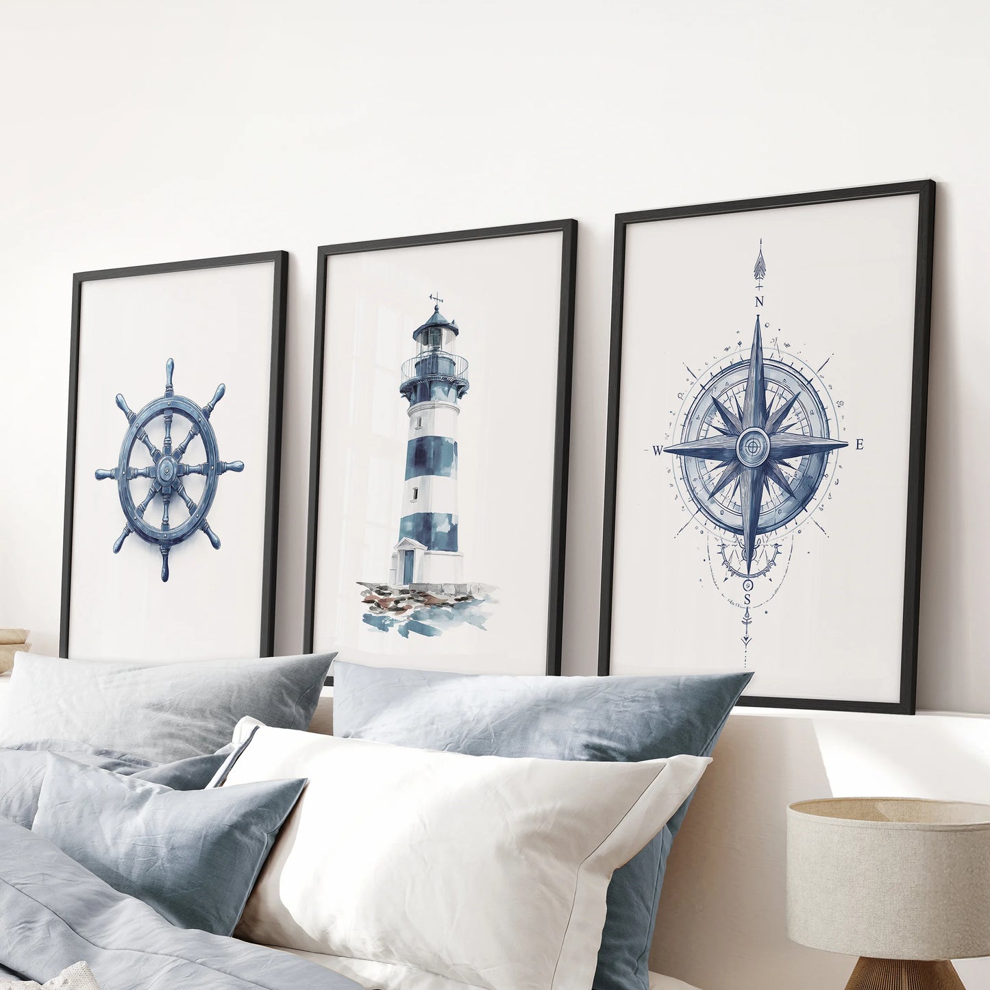 Compass 3-piece artwork set in black frames centers the blue bedroom, mounted over the bed for clean, graphic coastal wall art with navy accents.