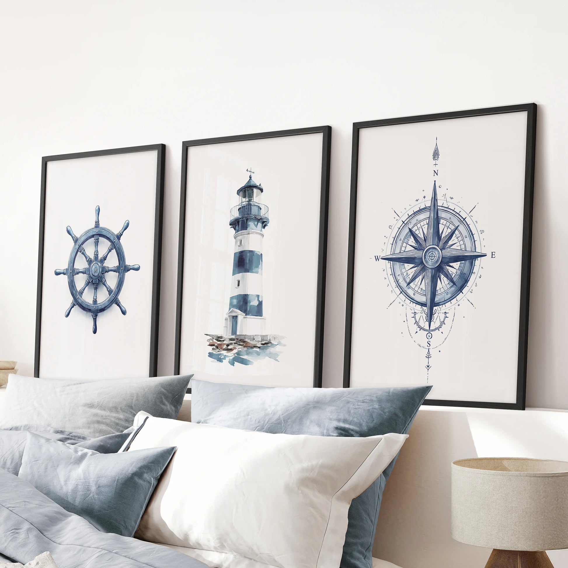 Compass 3-piece artwork set in black frames centers the blue bedroom, mounted over the bed for clean, graphic coastal wall art with navy accents.