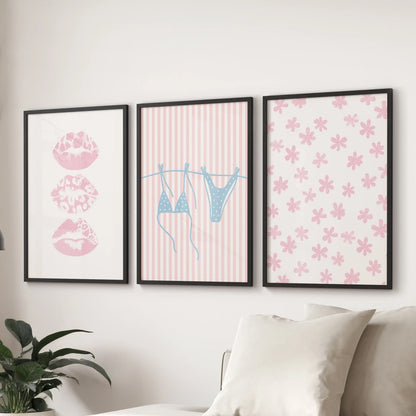 Light blue bikini artwork in a 3-piece wall art set enlivens the family room, arranged over the couch in crisp black-framed prints.
