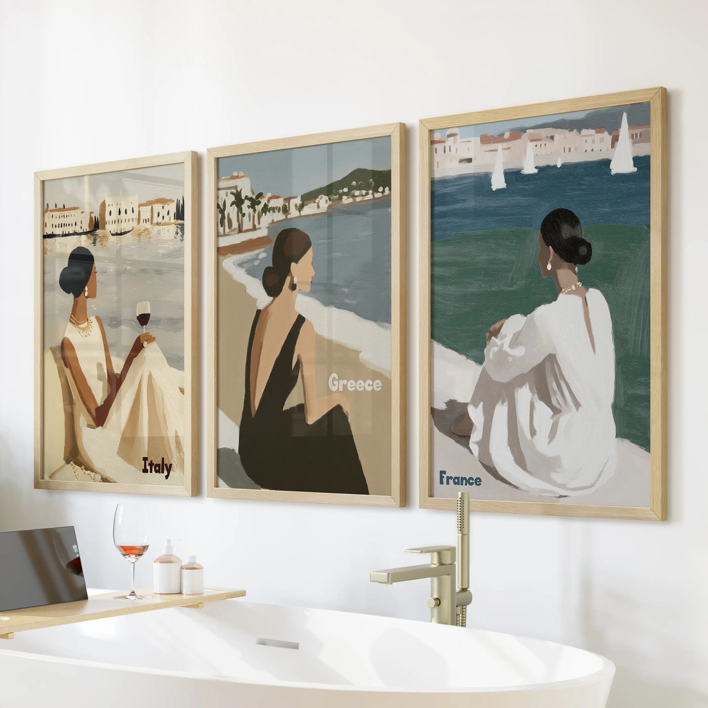 Siesta moments three-piece wall art set in light oak frames rests over the bath, mellowing the bathroom with warm wood tones and languid coastal ease.
