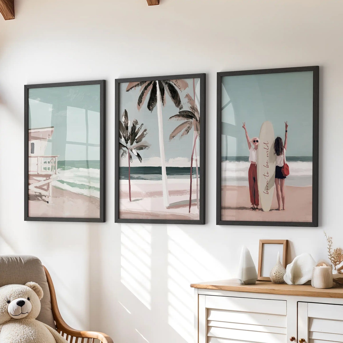 Palm tree beach prints, a three-piece art set, arrive as black-framed prints styled over the chest of drawers in a bright, kid-friendly room.