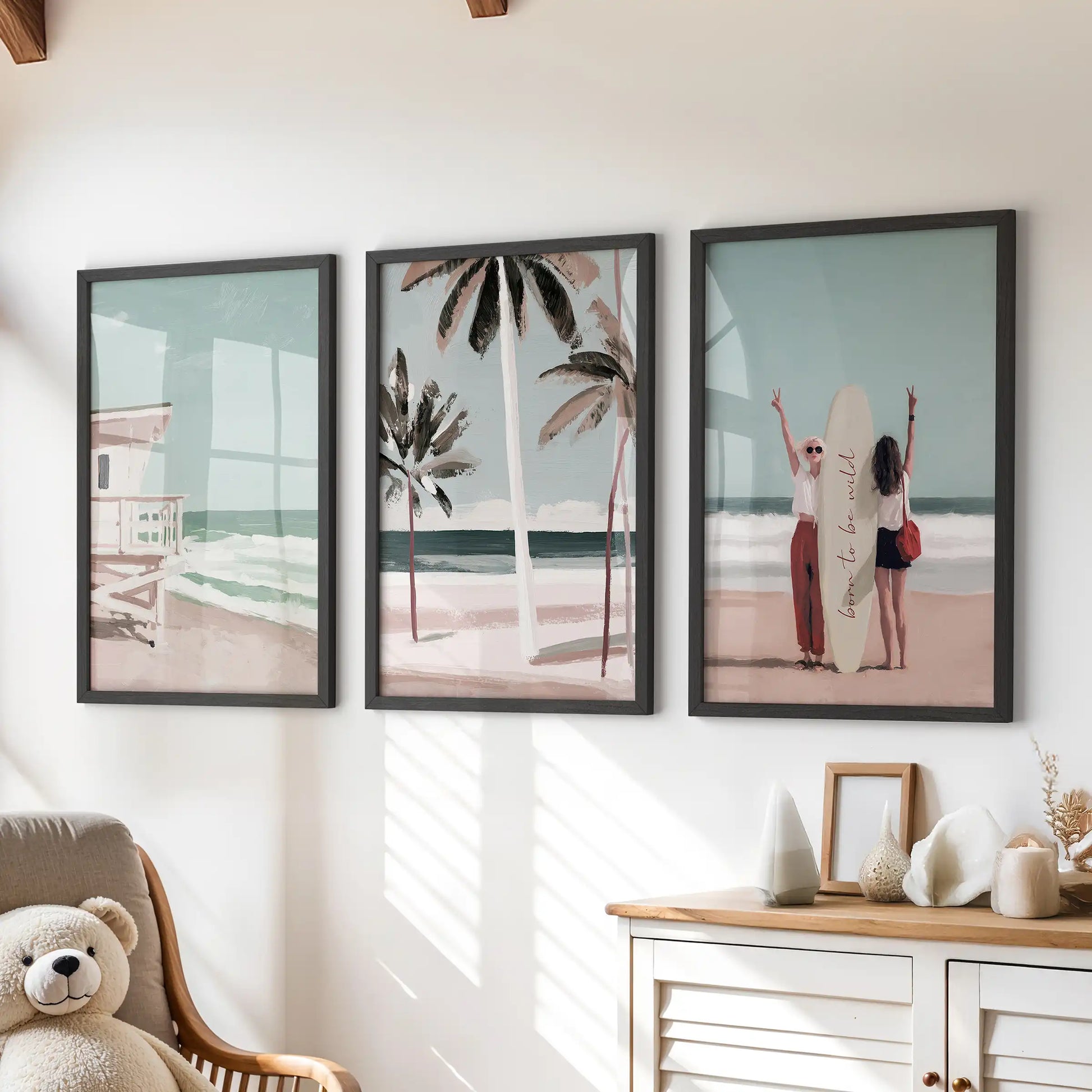 Palm tree beach prints, a three-piece art set, arrive as black-framed prints styled over the chest of drawers in a bright, kid-friendly room.