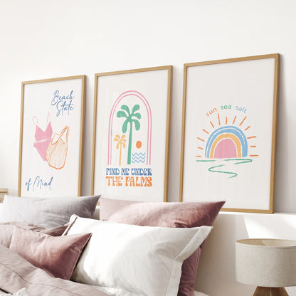 Tropical bikini illustration wall art, three-print set in warm wood frames, completes the pink bedroom and hangs above the bed.