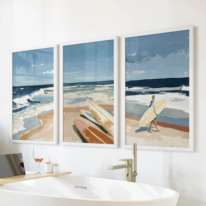 Ocean wave triptych wall art, three framed pictures, are arranged over a freestanding tub in crisp white frames, bringing spa-like calm to the bathroom.