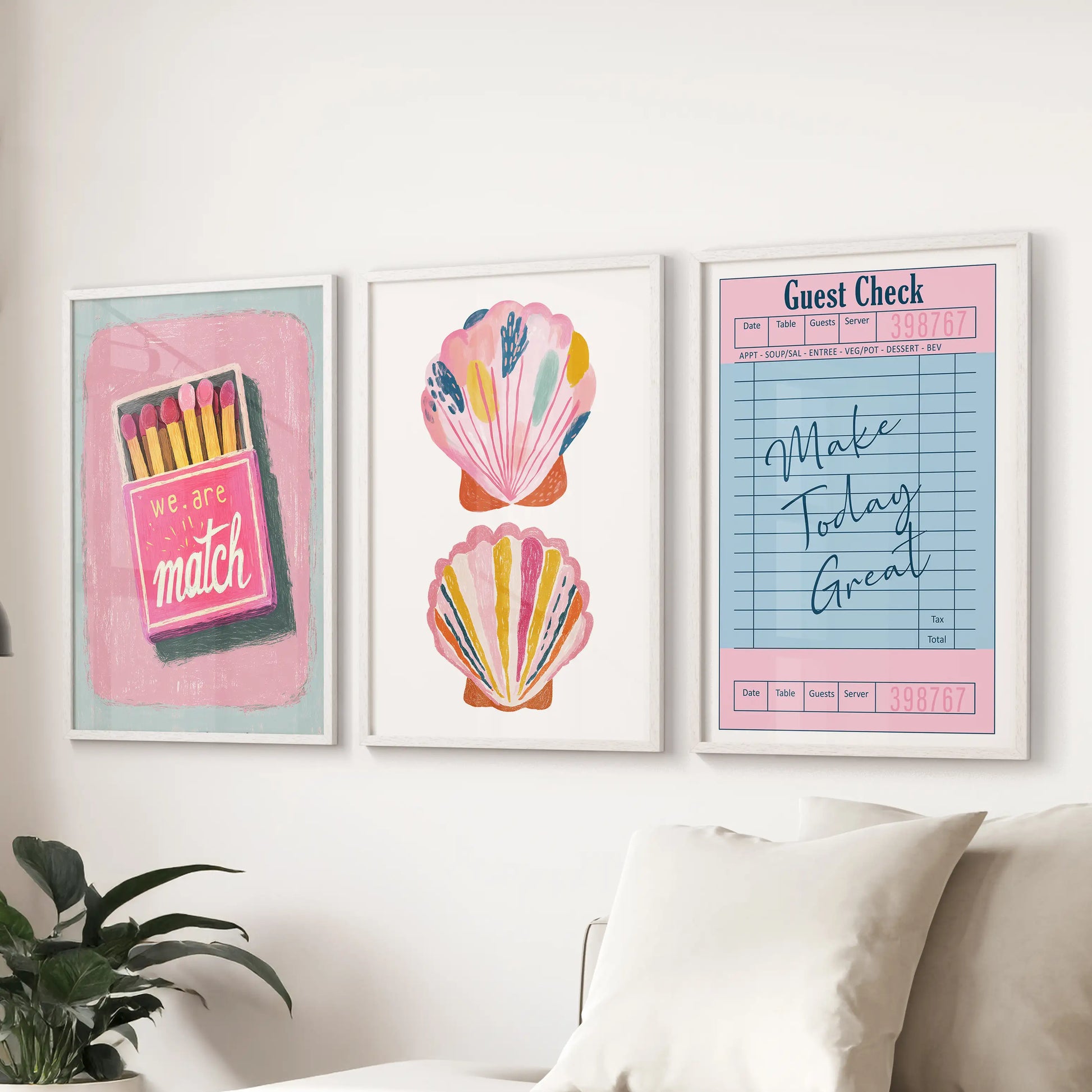 An eclectic three-piece wall set in white frames brings lively summer color above the sitting-room couch with an easy, collected feel.
