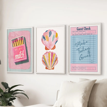 An eclectic three-piece wall set in white frames brings lively summer color above the sitting-room couch with an easy, collected feel.