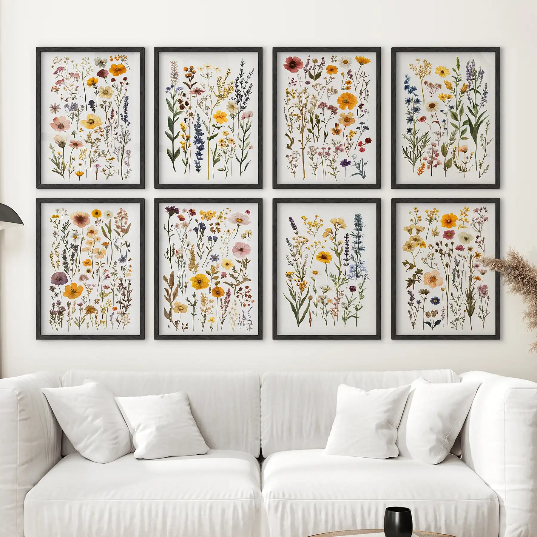 Pressed flower artwork set with delicate wild blooms. Floral gallery wall decor. Black frames for cozy and bright room decor. 