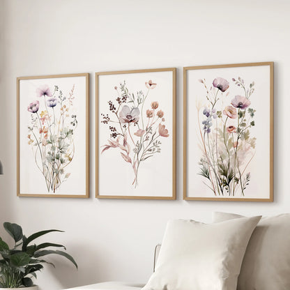 Watercolor botanicals art prints, a three-print set, in thin wood frames over the sofa to refresh the family room with a soft, botanical feel.
