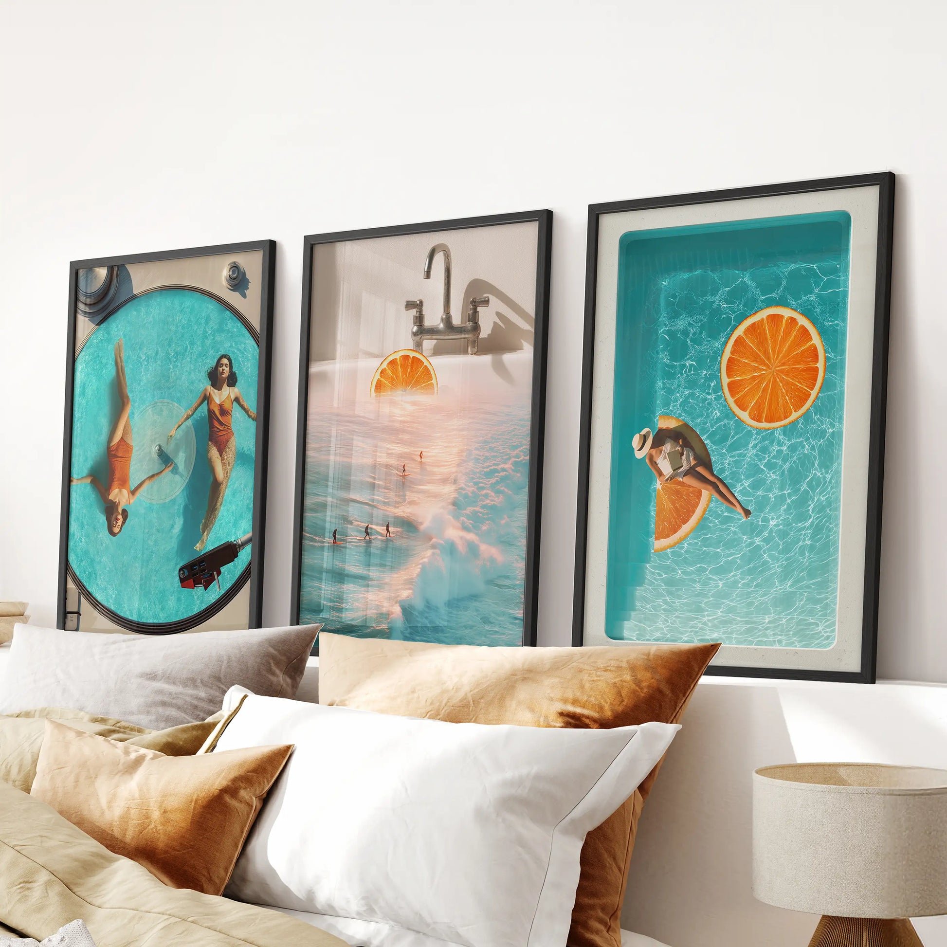 Three black-framed collage prints in coastal blues and oranges form a crisp, modern wall art accent above the bedroom headboard.