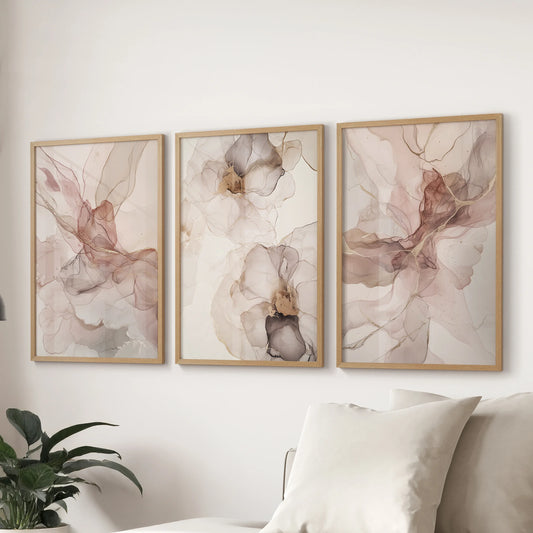 Oak-framed neutral abstract prints form a three-piece wall art arrangement, styled over a living-room couch for an easy, contemporary finish.