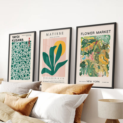 Matisse-inspired cutout prints in a wall art trio, set in slim black frames for the bedroom and hung over the headboard for a crisp, modern focal point.