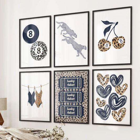 Six black-framed leopard print art pieces create a playful retro Y2K accent above the bed, completing this pared-down bedroom wall scene.