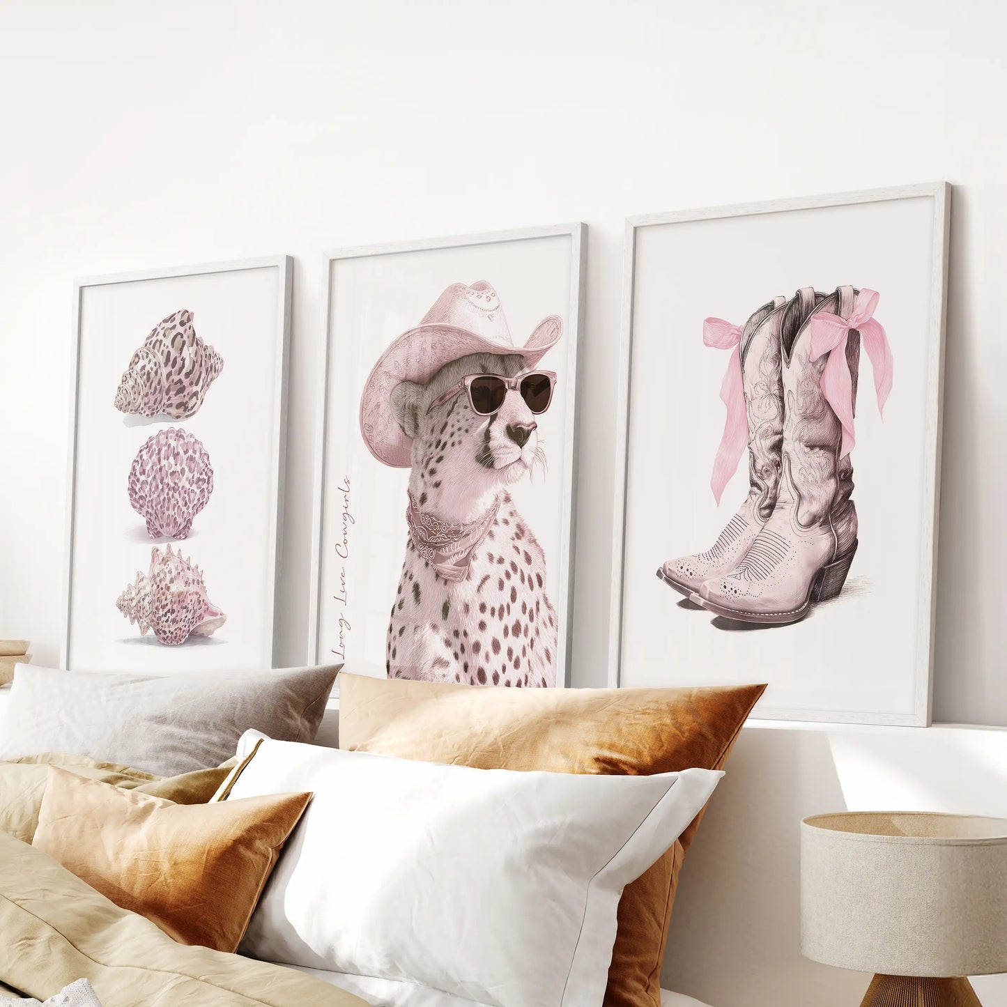 Pink cheetah three-piece wall art set in white frames freshens a bedroom over the bed with blush spots and a polished, playful edge.