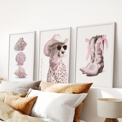 Pink cheetah three-piece wall art set in white frames freshens a bedroom over the bed with blush spots and a polished, playful edge.