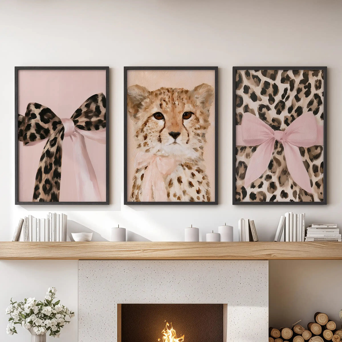 A trio of framed posters featuring preppy coquette animal art hangs in black frames over the hearth, giving the family room a crisp editorial pop.