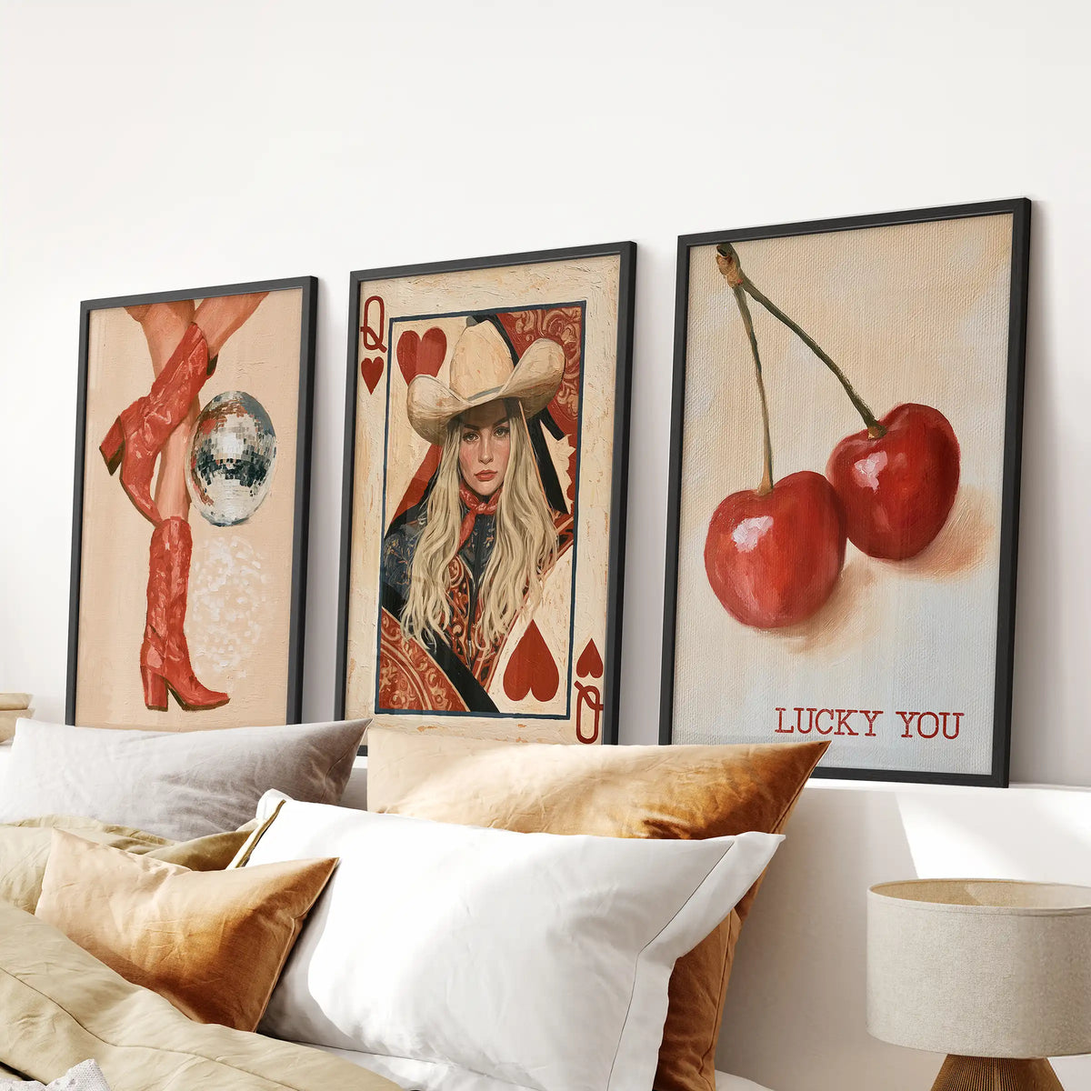Lucky You playing card 3-print wall art set, black-framed, centered over the headboard to add vintage whimsy to a bedroom.