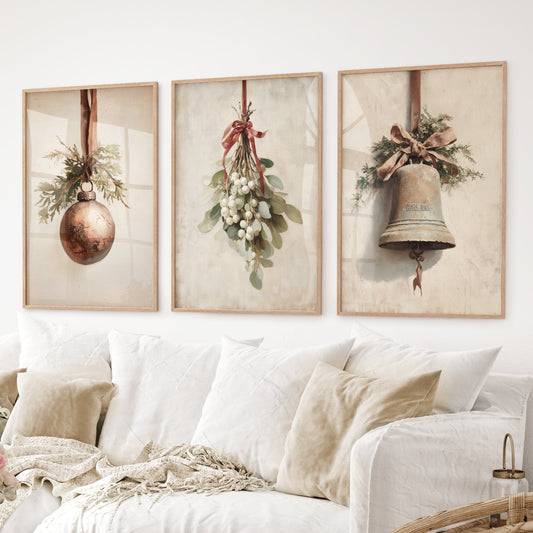 Christmas wall art set of 3 with ornament, mistletoe, and bell prints. Thinwood frames over the couch.