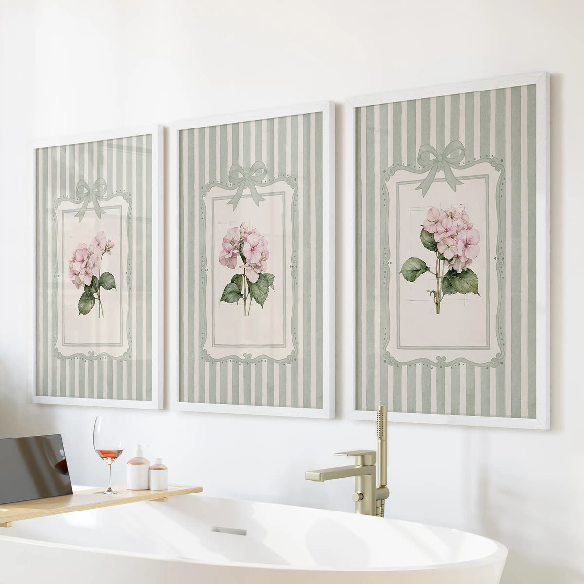 Set of three large wall art prints featuring pink hydrangea blooms in white frames above a bathroom bathtub.