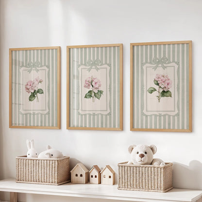 Three-piece wall art set of vintage botanical florals in natural wood frames above toy storage in a playroom.