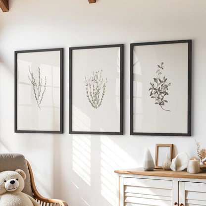 Dried wildflowers wall art set of three in black frames sits over a playroom chest of drawers, bringing soft, rustic texture to a clean space.